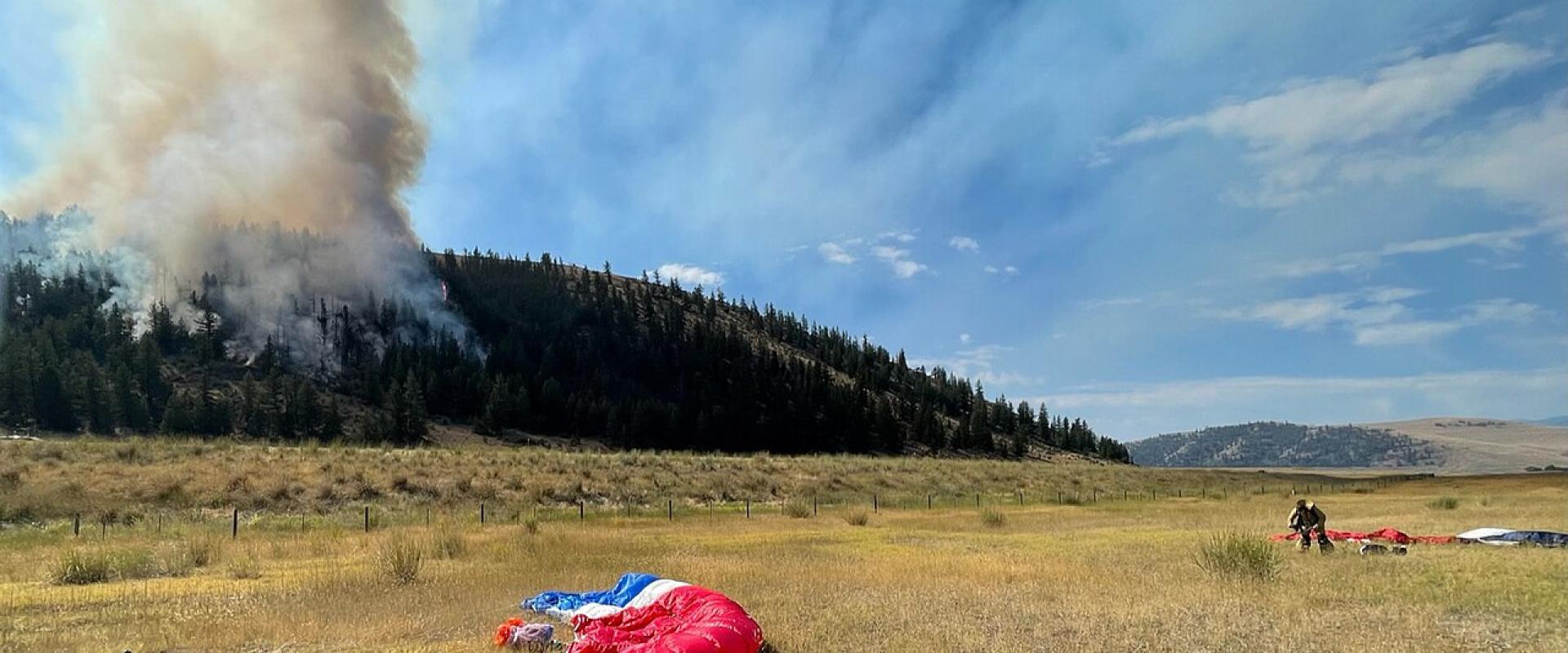 Missoula smokejumpers' parachutes on a fire line