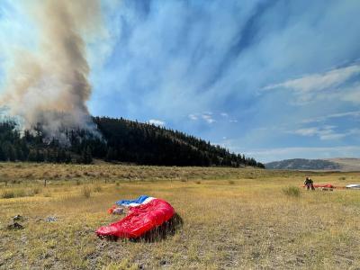 Missoula smokejumpers' parachutes on a fire line