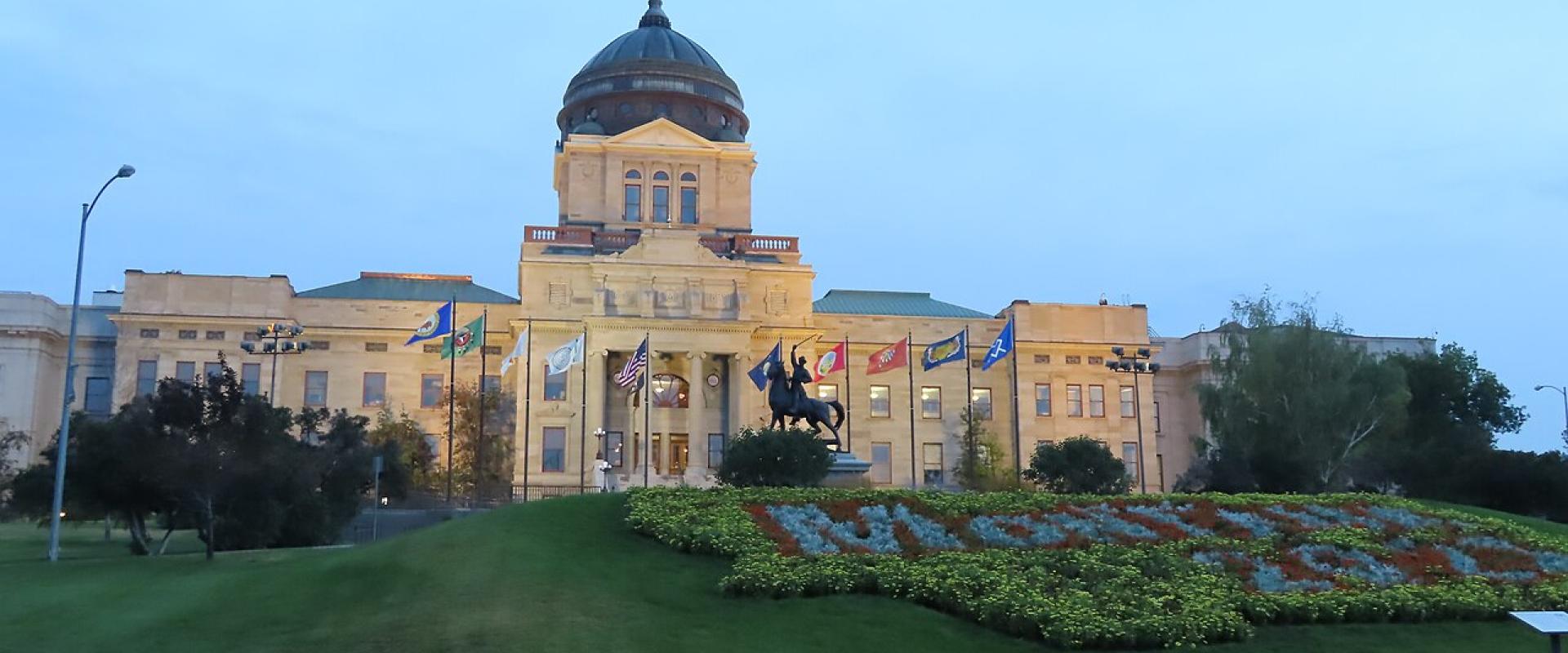 The Montana State Capitol in Helena, with its copper dome and flower beds