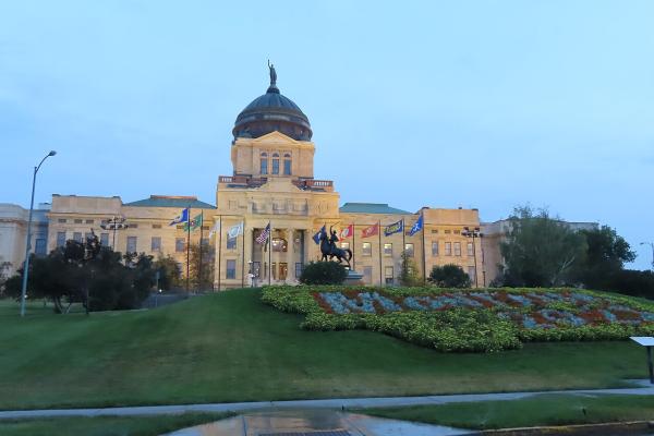 The Montana State Capitol in Helena, with its copper dome and flower beds